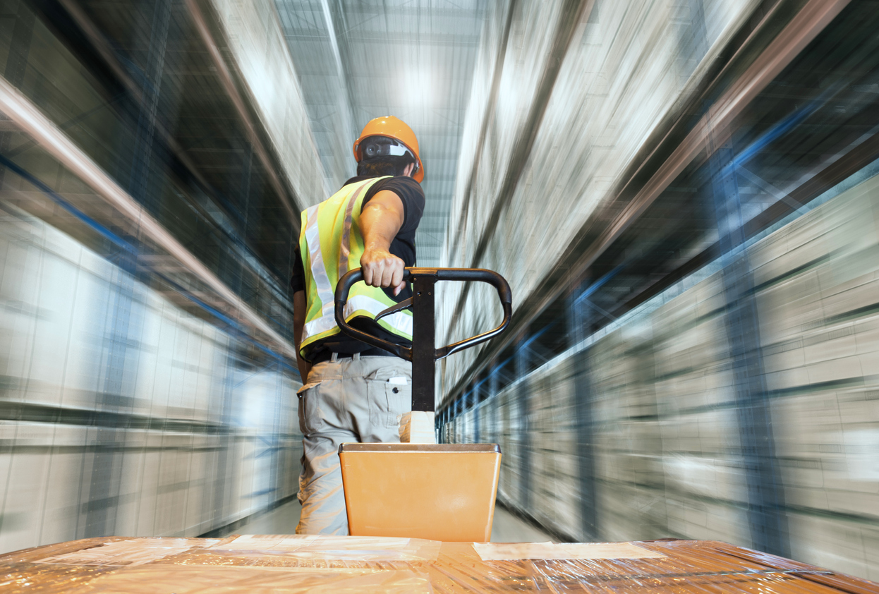 warehouse worker in motion with fork